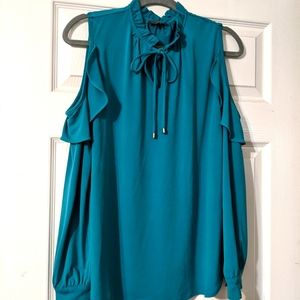 Cold shoulder deep blue top. Ruffle detail.